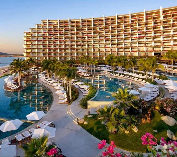 Beachfront resort with pools and palm trees